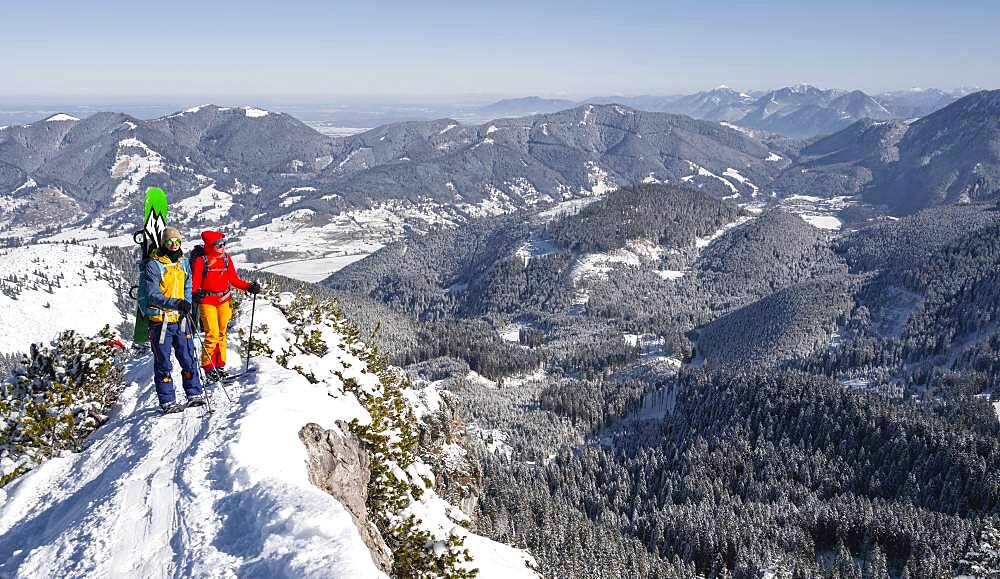 Young woman and man on ski tour, ski tourers on tour to Teufelstaettkopf, Ammergau Alps, Unterammergau, Bavaria, Germany, Europe