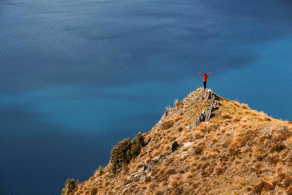 Guy on a mountain at Lake Hawea, Otago Region, Queenstown-Lakes District, South Island New Zealand