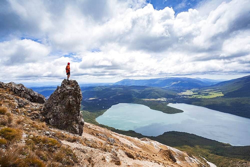 New Zealand, South Island, Region Tasman, Nelson Lakes National Park, Lake Rotoiti, guy standing on rock, Oceania