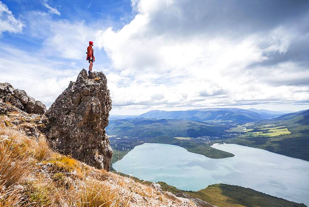 New Zealand, South Island, Region Tasman, Nelson Lakes National Park, Lake Rotoiti, guy standing on rock, Oceania