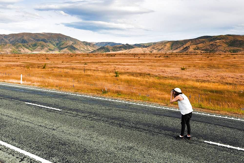 Guy with camera, Omarama, Waitaki District, Canterbury, South Island, New Zealand, Oceania