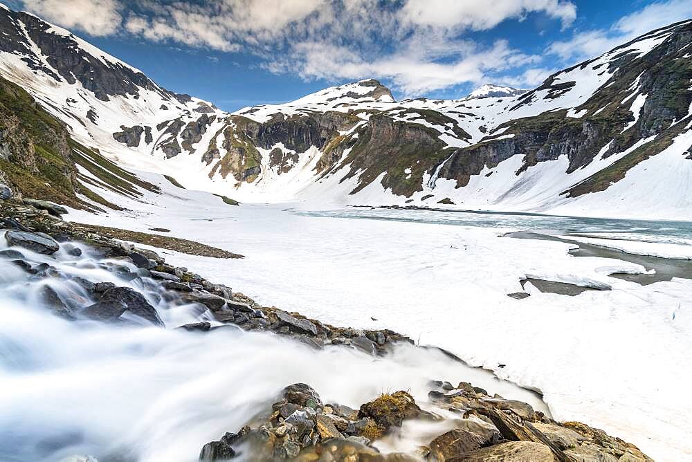 Mountain lake, partly frozen, Grossglockner High Alpine Road, Hohe Tauern National Park, Carinthia, Austria, Europe