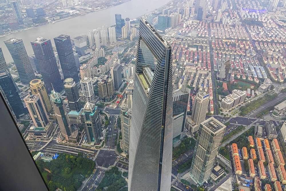 View from the highest observatory of the world on 562 meters height in the 632 meters high skyscraper Shanghai Tower to the special economic zone Pudong with the 492 meters high Shanghai World Financial Center, nicknamed The Bottle Opener, Shanghai, People's Republic of China