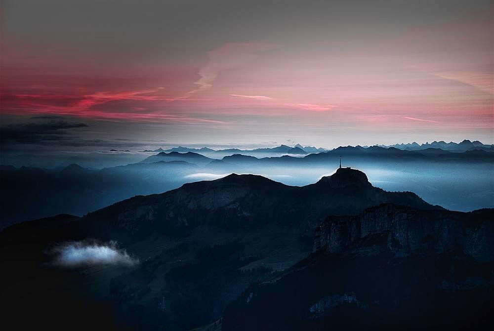 Sunrise and fog over mountains towards Lake Constance from summit Schaefler, in the Swiss canton Appenzell Innerrhoden, Alpstein area, Switzerland, Europe