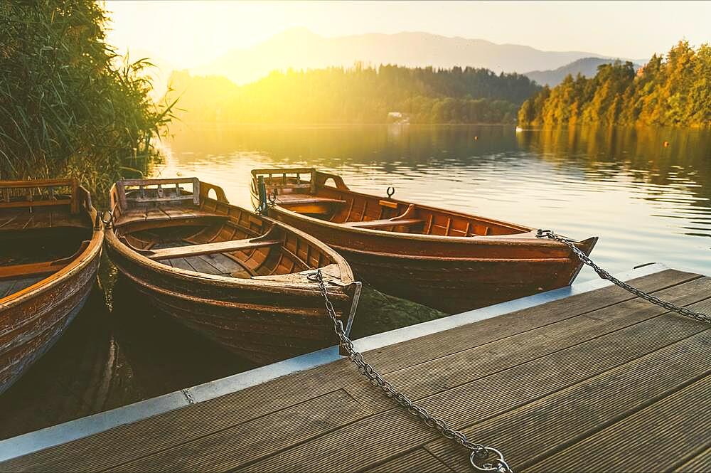 Wooden boats on a pier at sunset, small boat attached to the pier, Rivas, Nicaragua, Central America