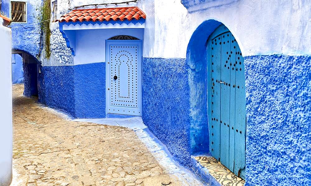 Streets and colored houses, View from the city street where all buildings are painted only in blue, the neighborhoods painted in vivid blue colors Cali, Colombia, South America