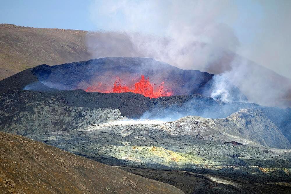 Sulphur fields in front of volcanic craters, glowing lava fountains, steam and shimmering air Fagradal Falls, Reykjanes, Grindavik, Iceland, Europe