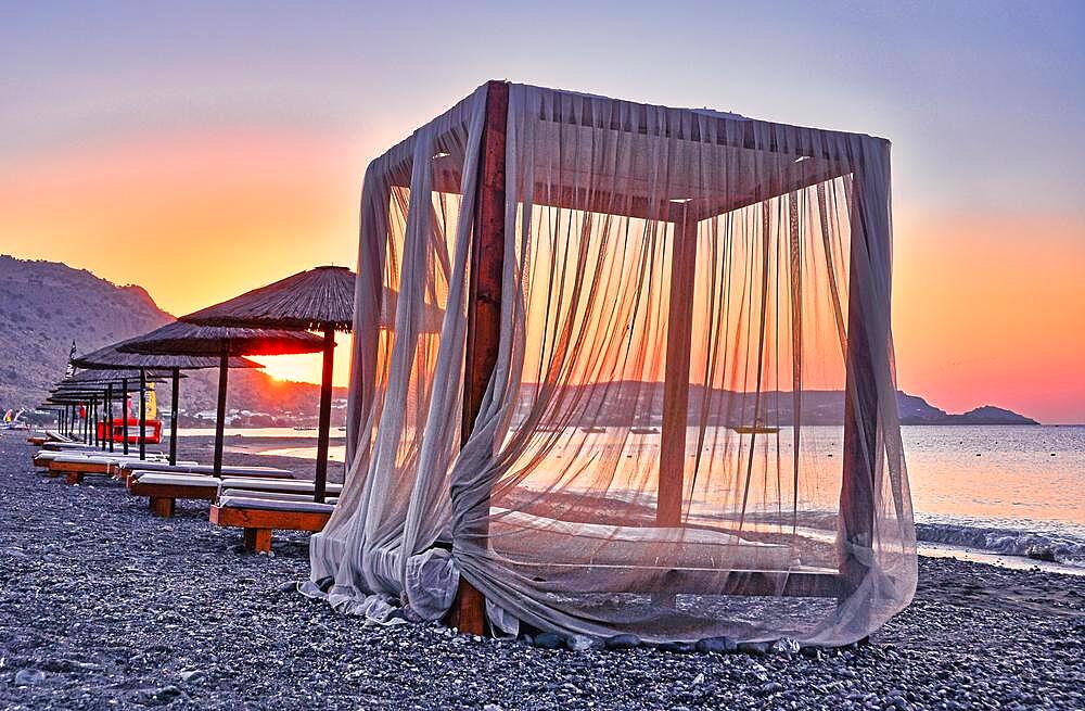 Canopy for beach loungers with curtains, sunrise, beach, Rhodes, Greece, Europe