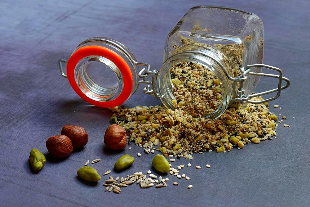 Dukkah, Arabic spice mix in glass container, nuts