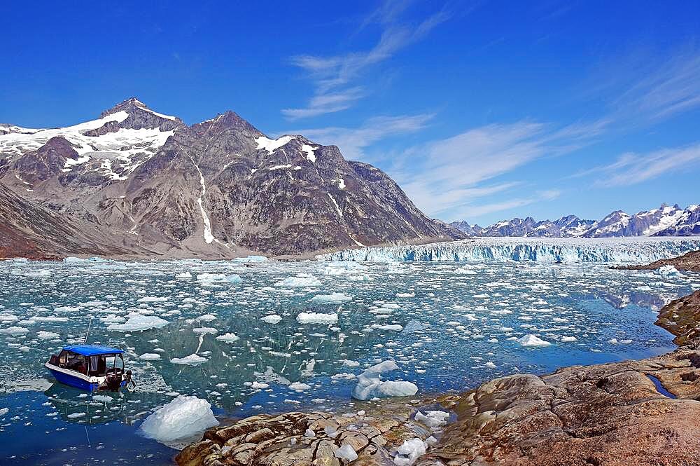 Boat in a fjord with drift ice, glacier and wild mountain landscape, Knud Rasmussen Glacier, Tasilaq, East Greenland, Greenland, Arctic, Denmark, North America