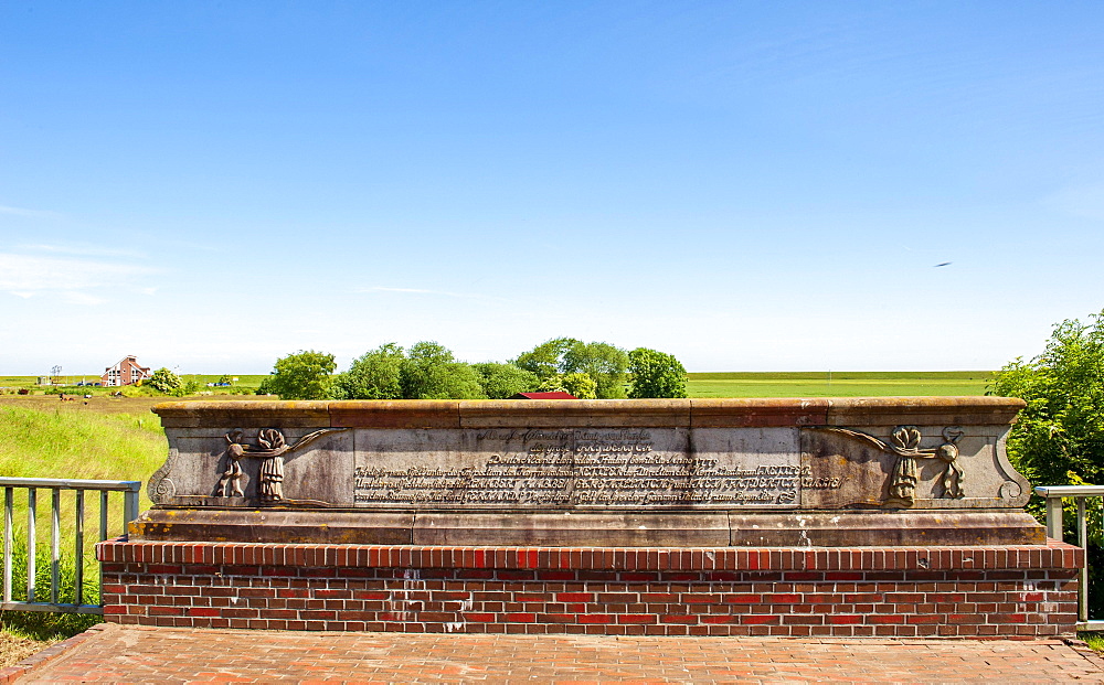 Base of the old siet gate with historical inscription, Nessmersiel, East Frisia, Lower Saxony, Lower Saxony Wadden Sea National Park, Germany, Europe