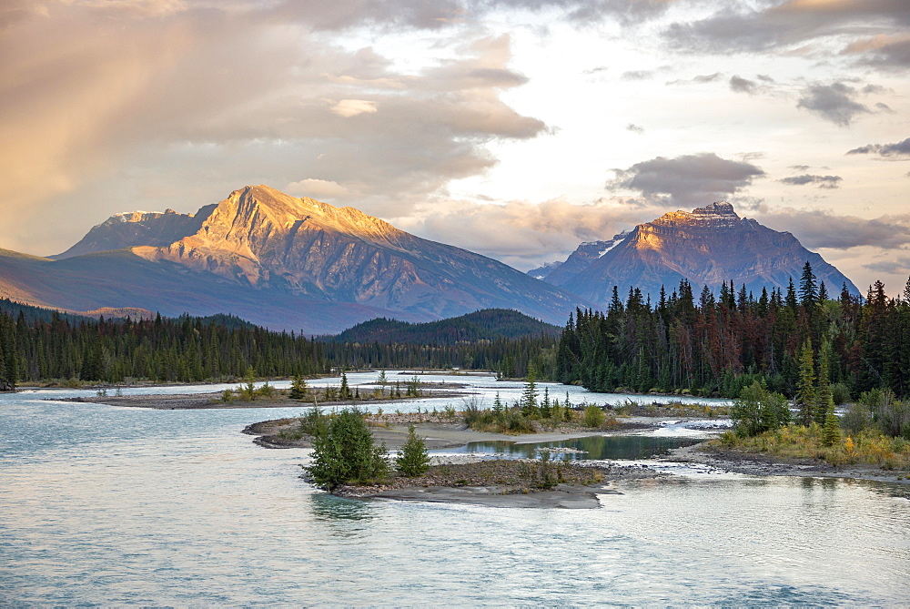 View of a valley with river, mountains in the evening light, Mount Hardisty and Mount Kerkeslin, sunset, Icefields Parkway, Athabasca River, Jasper National Park, Alberta, Canada, North America