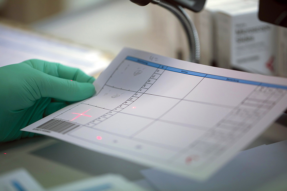 Scanning a protocol in a laboratory, Freiburg, Baden- Wuerttemberg, Germany, Europe