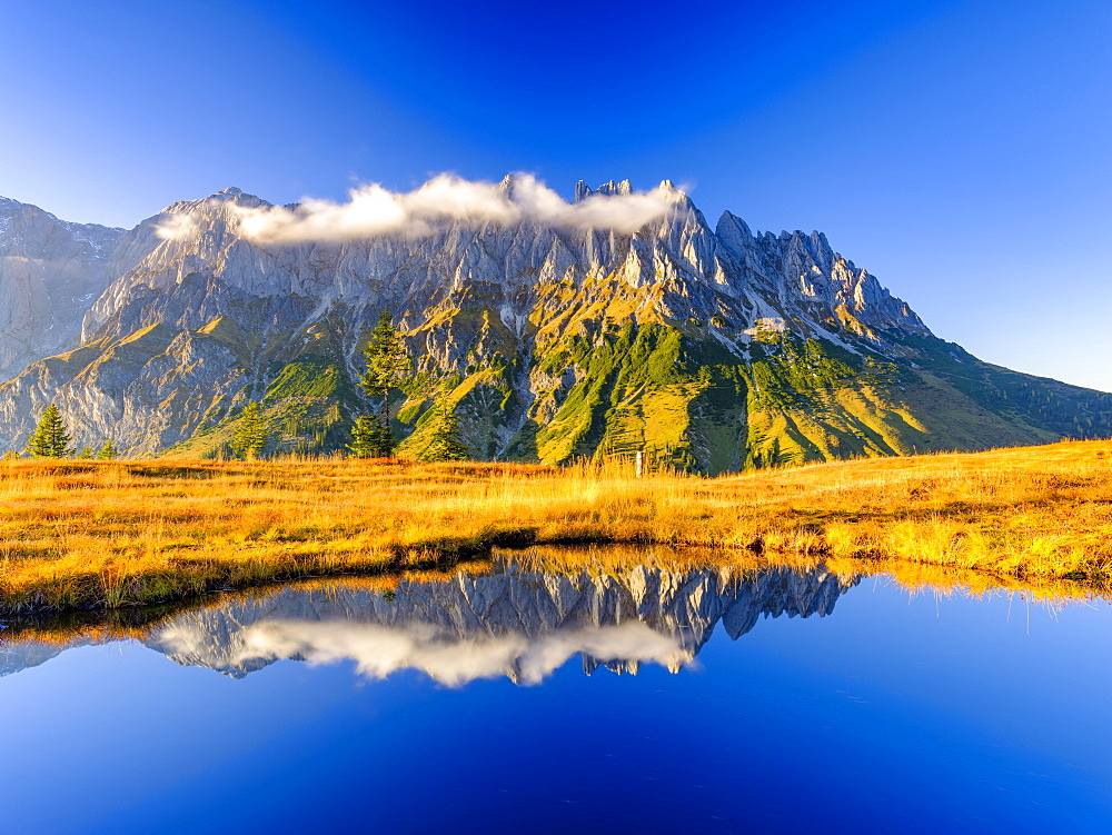 Mandlwaende reflected in a mountain lake, Mandlwand, Hochkoenig, Berchtesgaden Alps, Muehlbach am Hochkoenig, Pongau, Salzburg, Austria, Europe