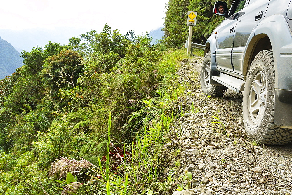 Tyres of an off-road vehicle, Toyota Land Cruiser, near the precipice on the Death Road, Camino de la Muerte, La Paz Department, Bolivia, South America