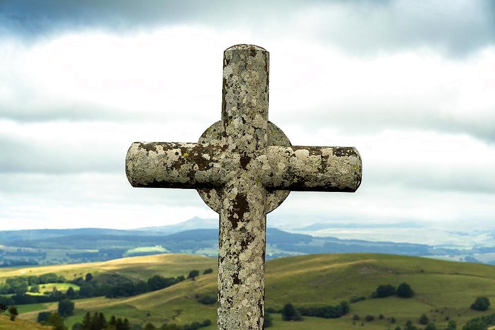 Stone cross. Massif of Sancy. Auvergne Rhone Alpes. France