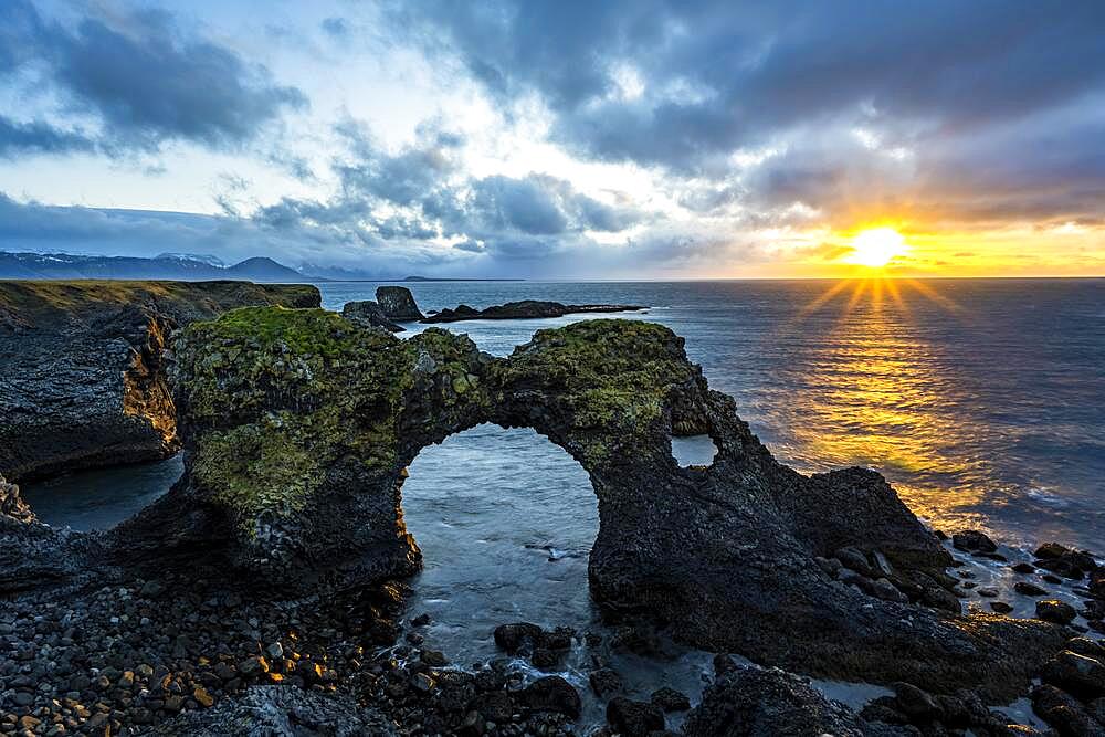 Gatklettur at sunrise, rock arch in the sea, Arnarstapi, Snaefellsnes Peninsula, West Iceland, Iceland, Europe