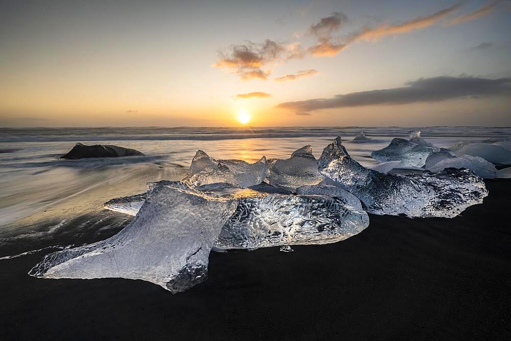 Diamond Beach, icebergs on black lava beach, at Joekulsarlon glacier lagoon, sunrise, Vatnajoekull National Park, Hornafjoerour, South Iceland, Iceland, Europe