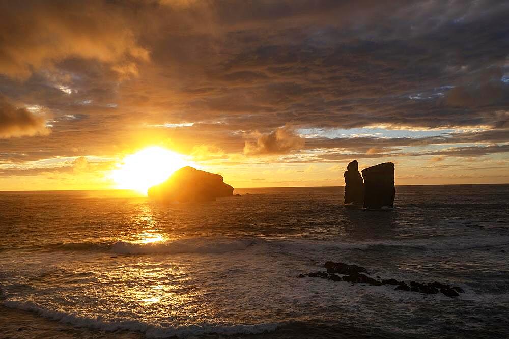 Drone shot, sunset at the rocky island Ilheus dos Mosteiros, Mosteiros, Sao Miguel Island, Azores, Portugal, Europe