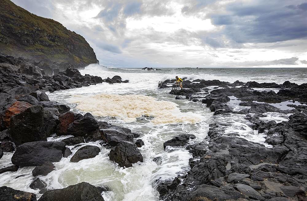 Natural thermal bath Termas da Ferraria at high tide with high waves, Ponta da Ferraria, Sao Miguel Island, Azores, Portugal, Europe