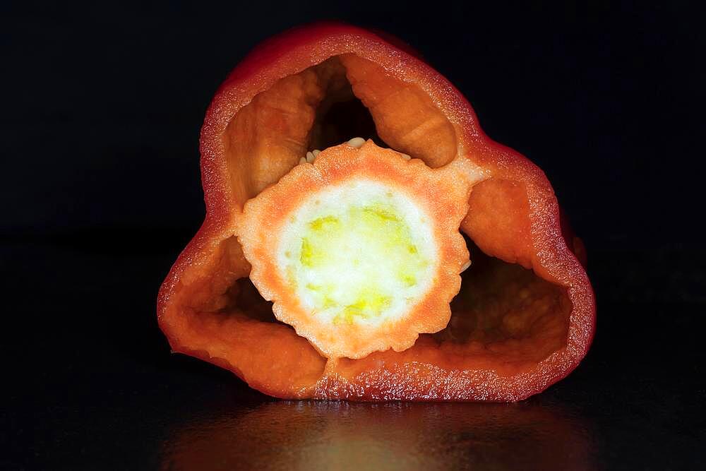 Sliced red pointed peppers, studio photography with black background