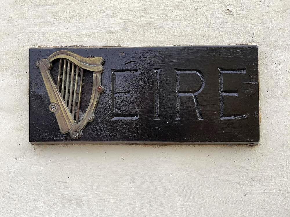 Small wooden sign with Irish harp and lettering Eire on house wall, Malta, Europe