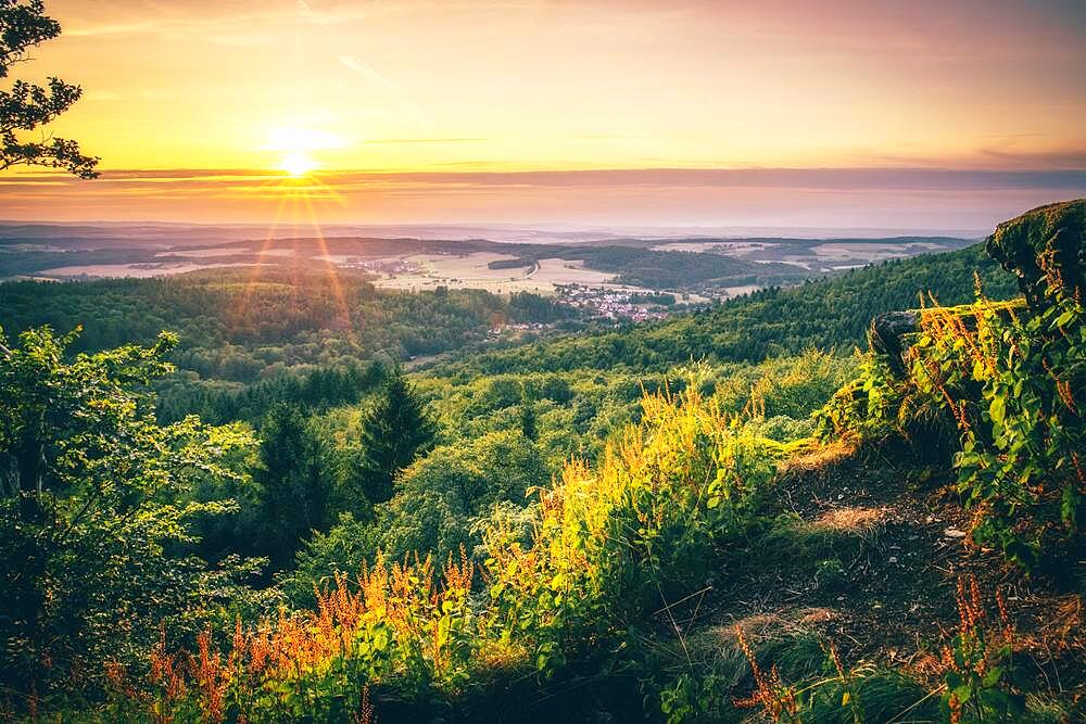 View at sunset from the slate rock Grossen Zacken in the Taunus, forests, meadows, farmland, Hesse, Germany, Europe