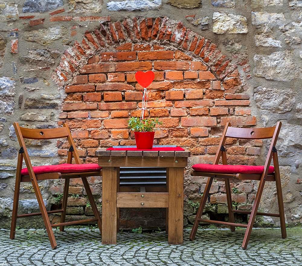 Seat for lovers in front of bare wall, Erfurt, Thuringia, Germany, Europe