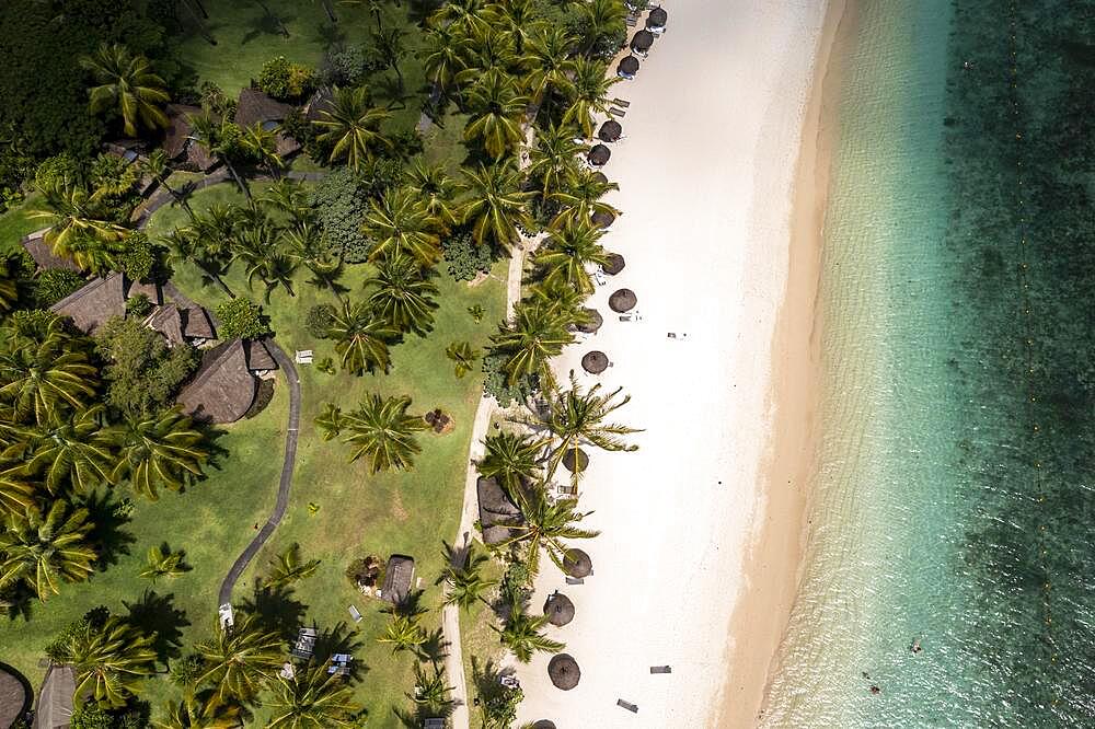 Aerial view, The beach of Flic en Flac with the luxury hotel La Pirogue Resort & Spa and palm trees, Mauritius, Africa