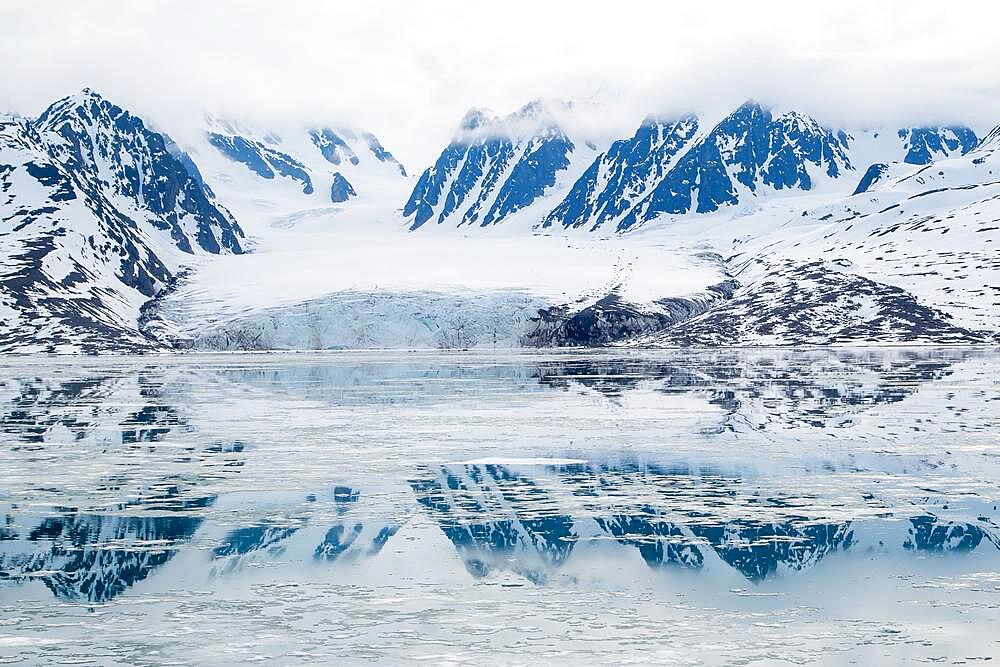 Monaco Glacier, reflected in the water, Liefdefjorden, Spitsbergen, Norway, Europe