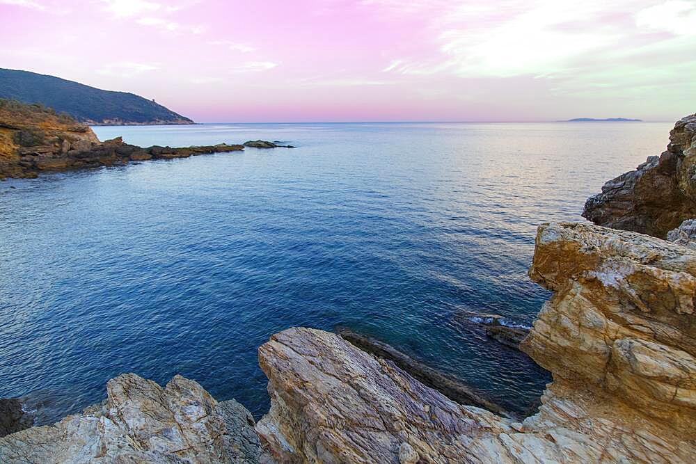 Characteristic rocks of the bathing bay Mar Morto in the evening light, Monte Argentario, Tuscany