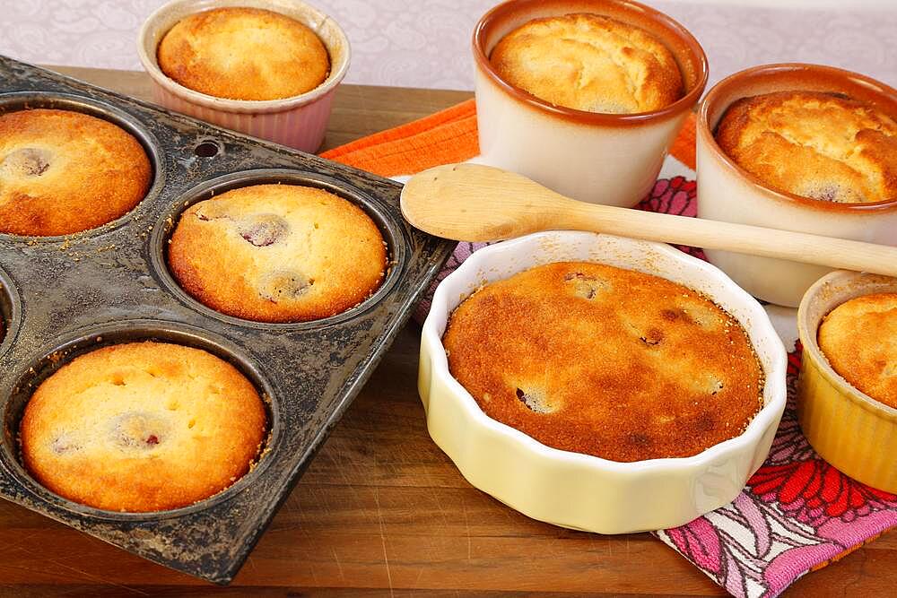 Swabian baking, Kirschenmichel fine version, dough with cherries in baking tin, wooden stirring spoon, Germany, Europe