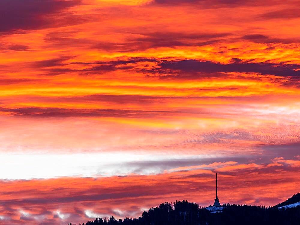 Clouds above the summit of the Mugel in the morning red at sunrise, Mugel, Leoben, Styria, Austria, Europe