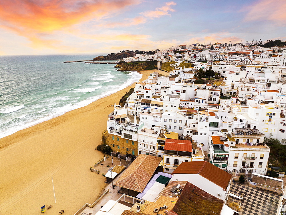 Aerial view of whitewashed architecture of Albufeira by the Atlantic Ocean at sunset, townscape, Algarve, Portugal, Europe