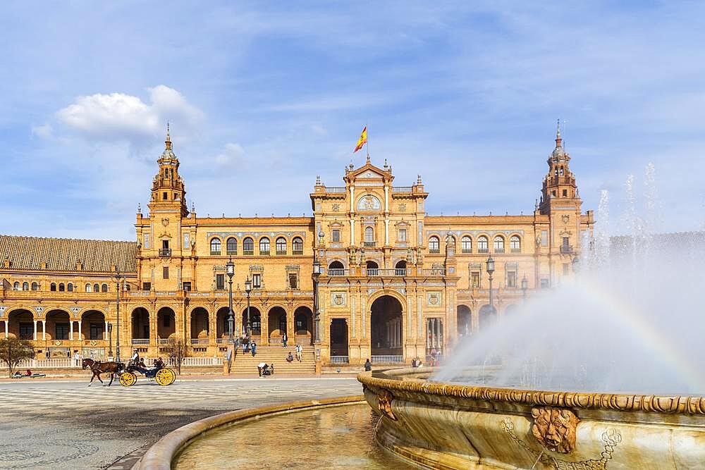 The most famous landmark in Plaza de Espana with the fountain in the foreground, Seville, Spain, Europe