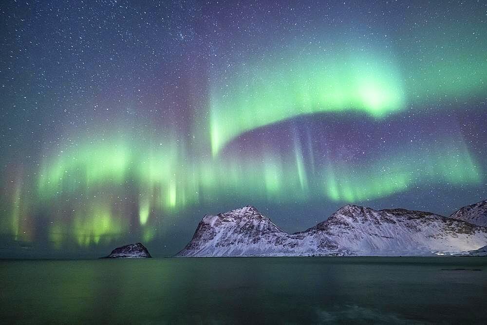 Northern Lights over Snowy Bergen, Haukland Beach, Lofoten, Norway, Europe