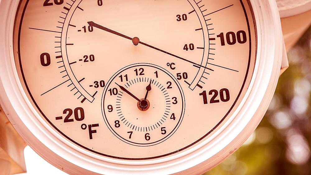 Round thermometer showing over 110 degrees