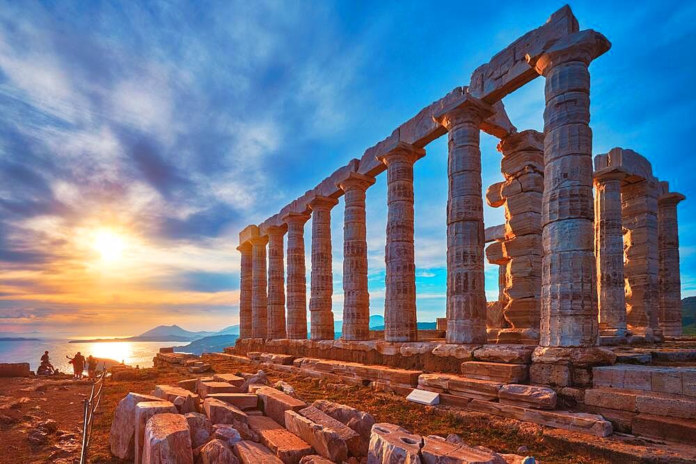 Greece Cape Sounio, Ruins of an ancient temple of Poseidon, Greek god of the sea, on sunset, Shot of temple ruins on sunset, Tourist landmark of Attica, Sounion, Greece, Europe