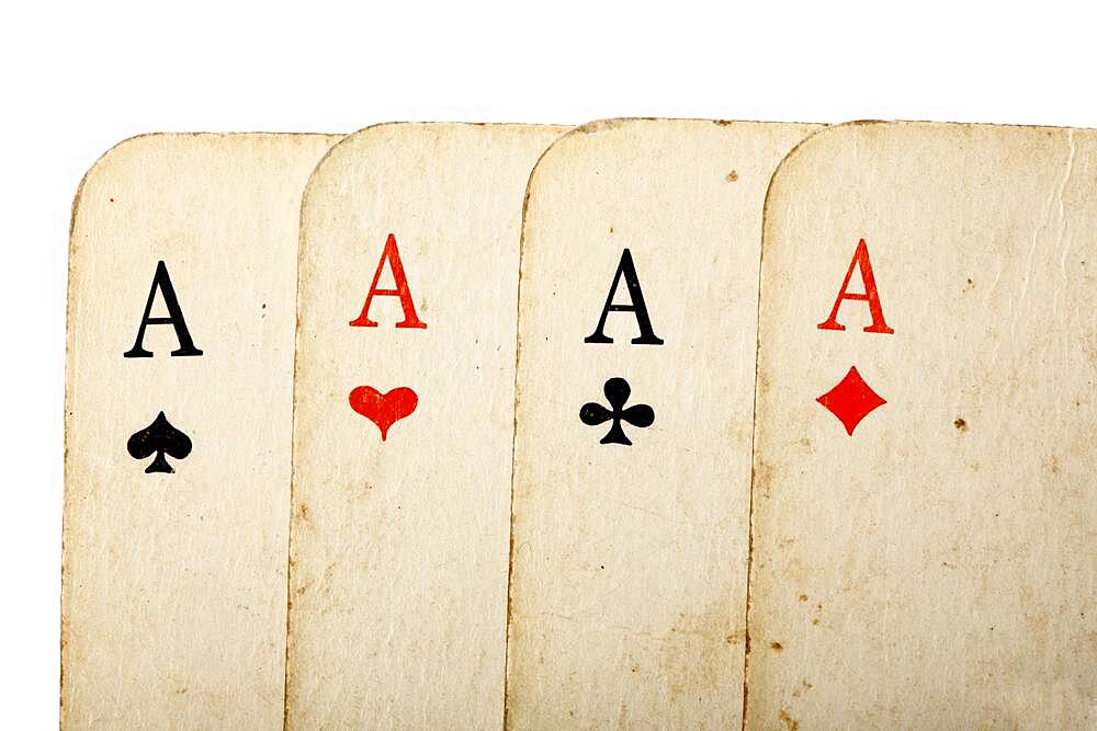 Four old cards (aces) close up