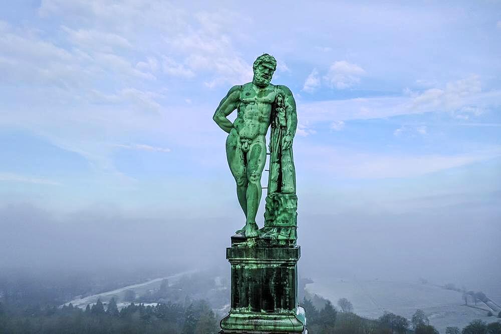 Drone photo, drone shot, close-up, monumental building Herkules, with central view of the statue, winter, snowy, fog, Bergpark Bad Wilhelmshoehe, Kassel, Hesse, Germany, Europe