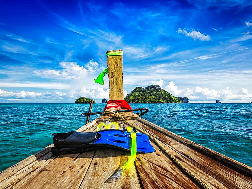 Snorkeling set on boat heading to tropical island in Thailand