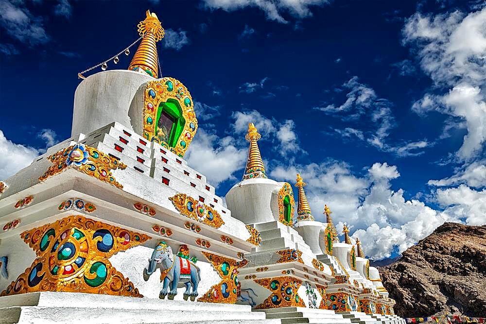 White chortens (Buddhist stupas) in Thiksey gompa. Ladakh, Jammu and Kashmir, India, Asia