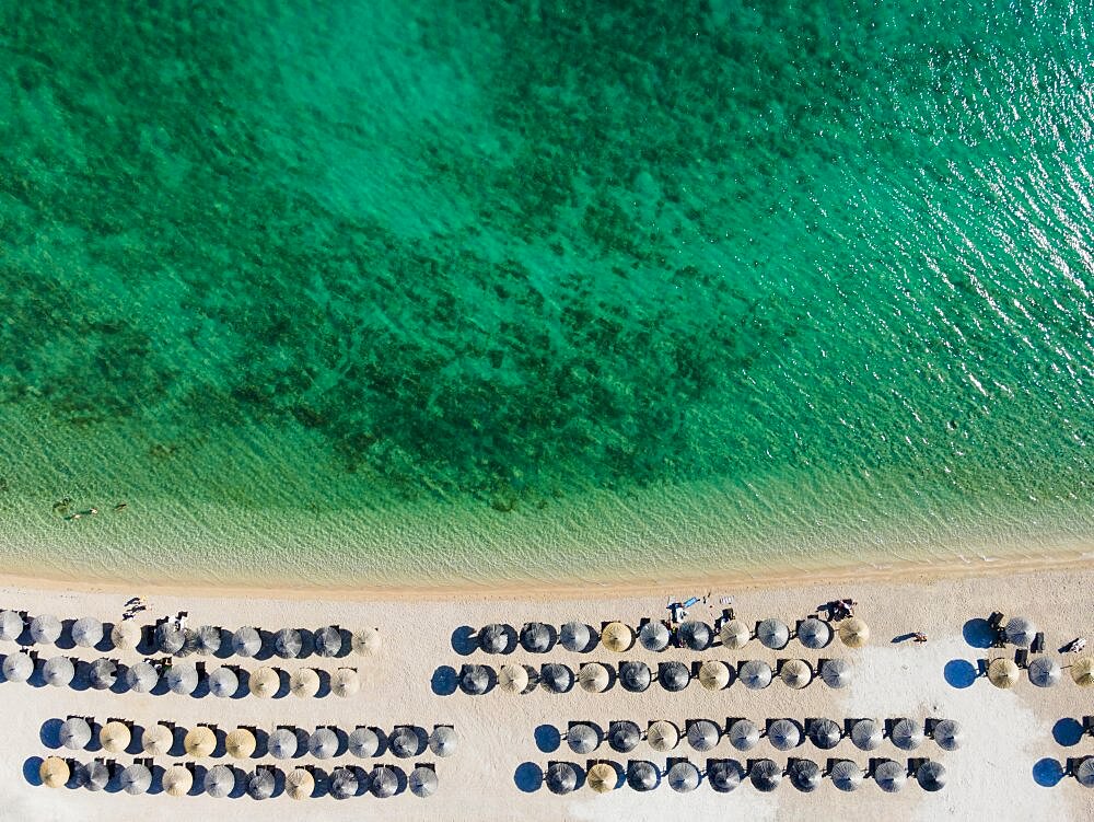 Drone shot, sunshades at White Beach, Sibenik, Sibenik-Knin, Dalmatia, Croatia, Europe