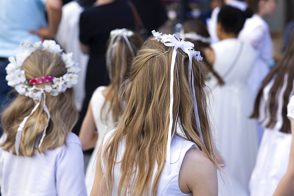 Girl with wreaths in her hair at the Corpus Christi procession, Cologne, North Rhine-Westphalia, Germany, Europe