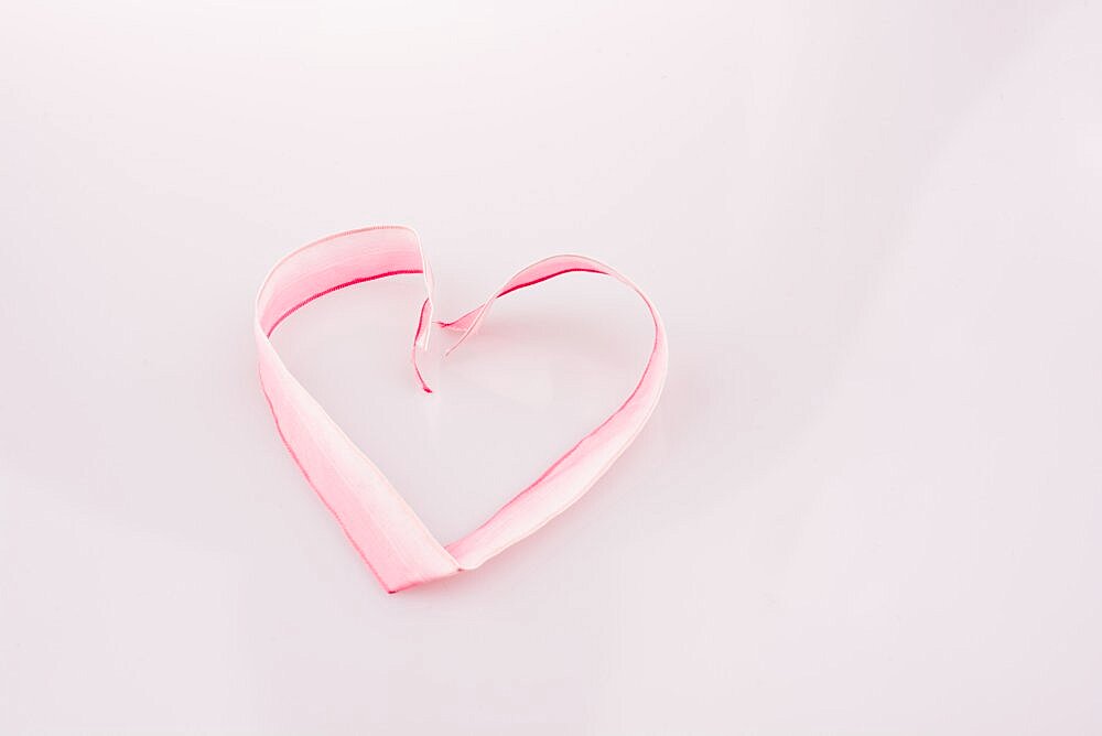 Heart made of ribbon on a white background