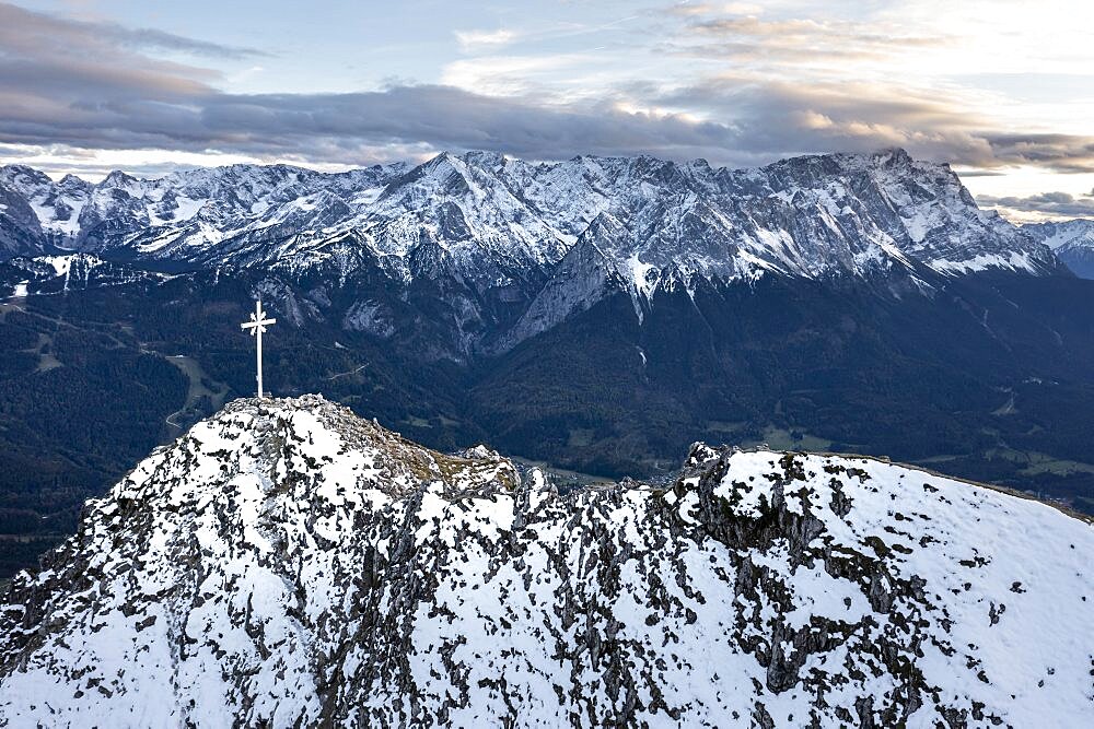 Alpine panorama with Zugspitze and summit cross of the Kramer, aerial view, mountains with snow in the evening, summit of the Kramer, Garmisch, Bavaria, Germany, Europe