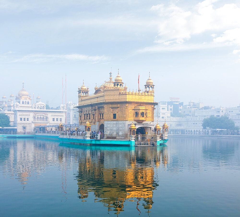 Sikh gurdwara Golden Temple (Harmandir Sahib) in morning fog. Amritsar, Punjab, India, Asia