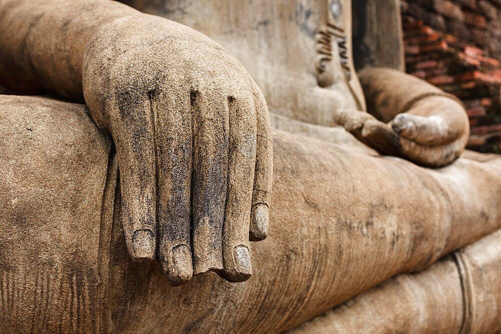 Buddha statue hand close up detail. Sukhothai, Thailand, Asia