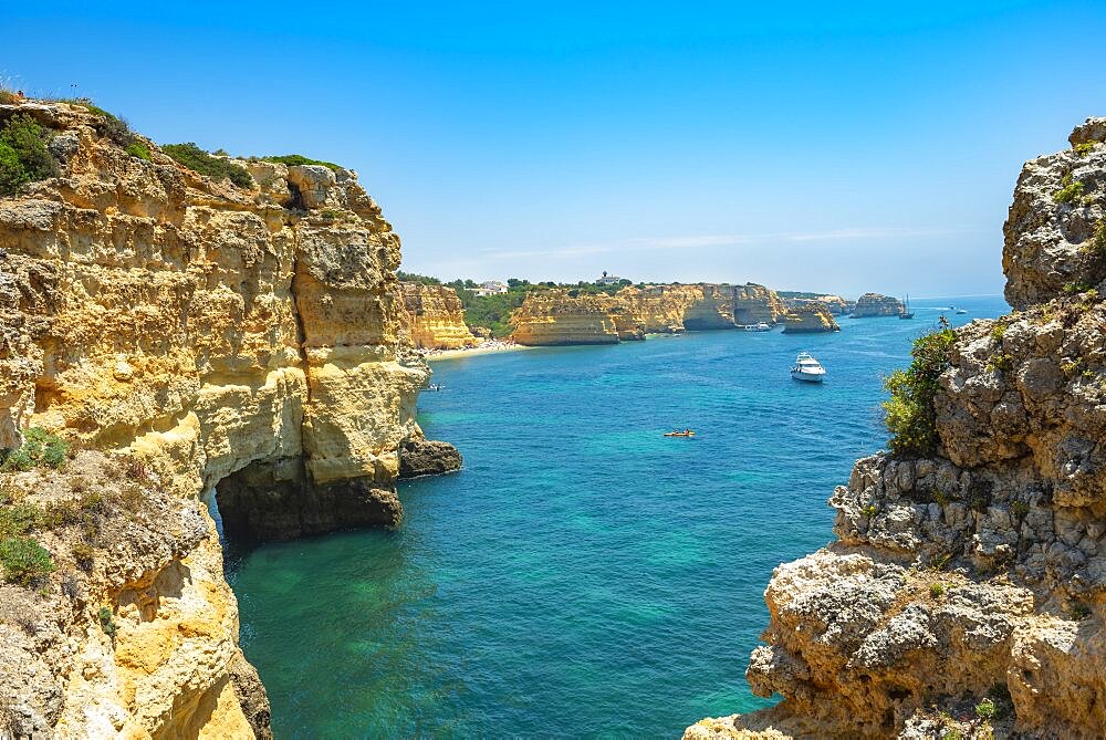 Turquoise sea, steep coast, Praia da Marinha beach, rugged rocky coast of sandstone, rock formations in the sea, Algarve, Lagos, Portugal, Europe