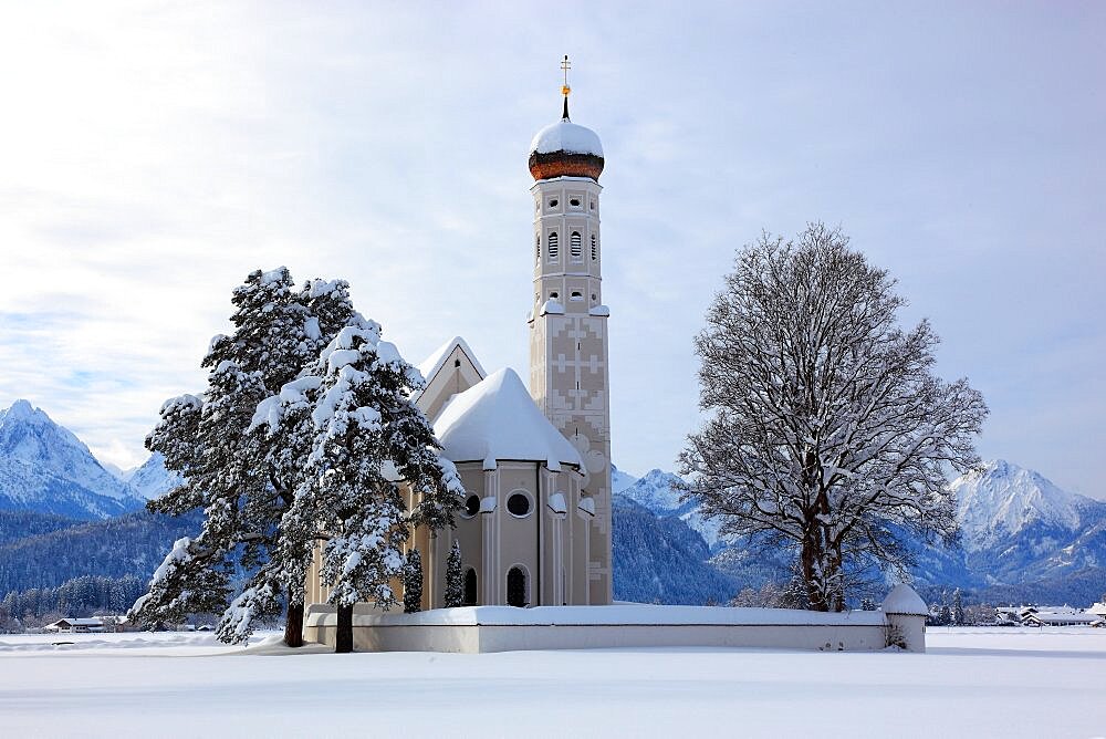 The baroque Coloman Church, St. Coloman, in winter in a landscape covered in deep snow, near Schwangau, Oestallgaeu, Swabia, Bavaria, Germany, Europe